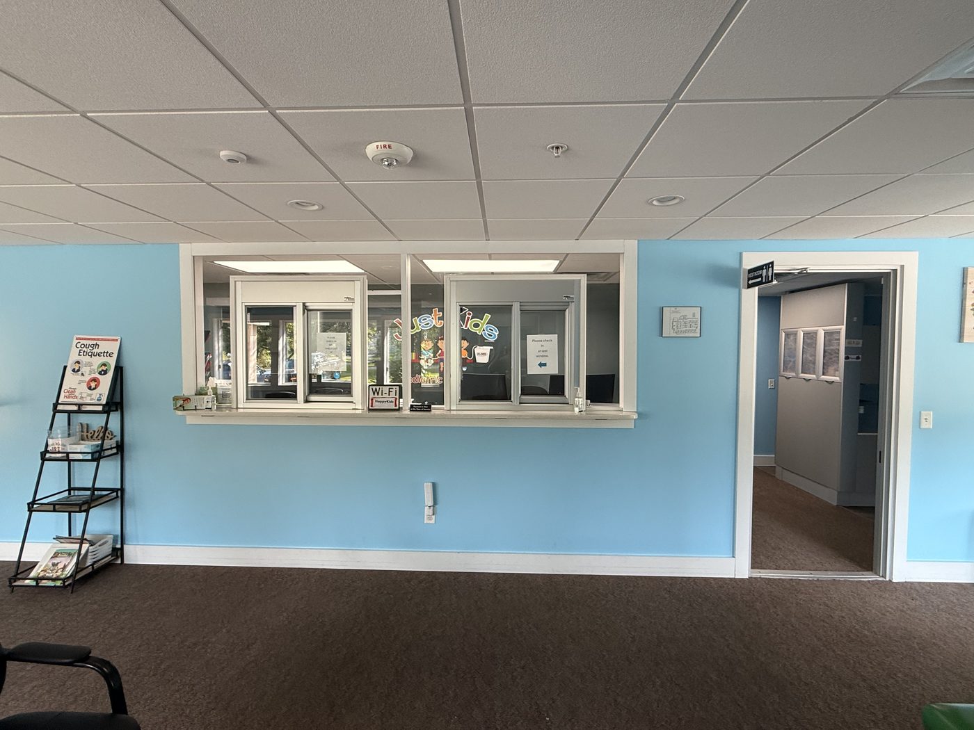 Our check-in windows — you'll see the Just Kids logo on the glass